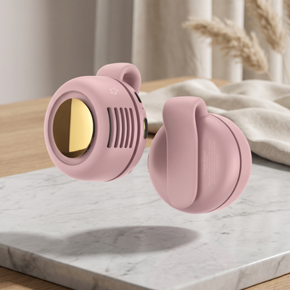 Close-up of the pink Mini Whirlwind portable fan highlighting the sleek gold-tone intake and durable waist clip.